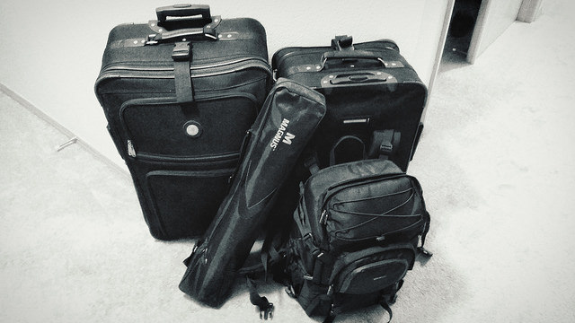 Four (4) pieces of luggage.